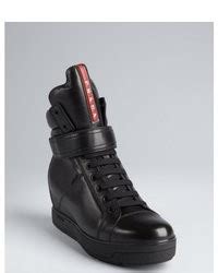 prada sport black leather oversized tongue high-top wedge sneakers|Leather and shearling high.